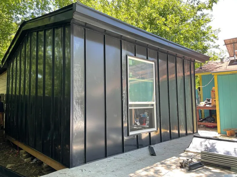 Black standing seam metal wall panels for Roof Inspection in Craig